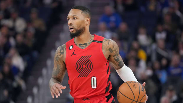 Portland Trail Blazers guard Damian Lillard brings the ball up the court against the Golden State Warriors.